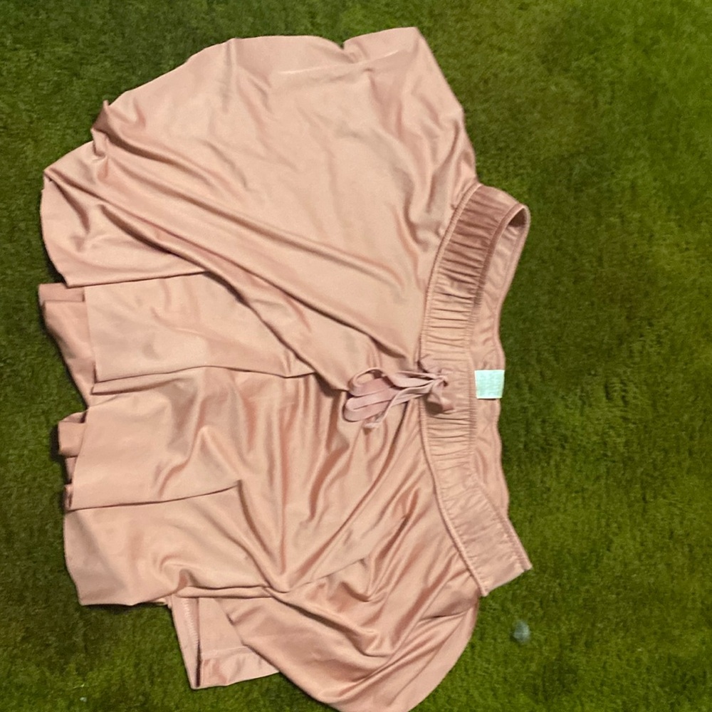 New in pink skirt with shorts under.